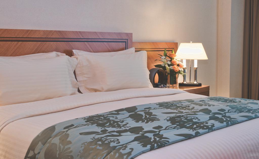 Wiseman Grand Hotel Doha Exterior photo A bed runner